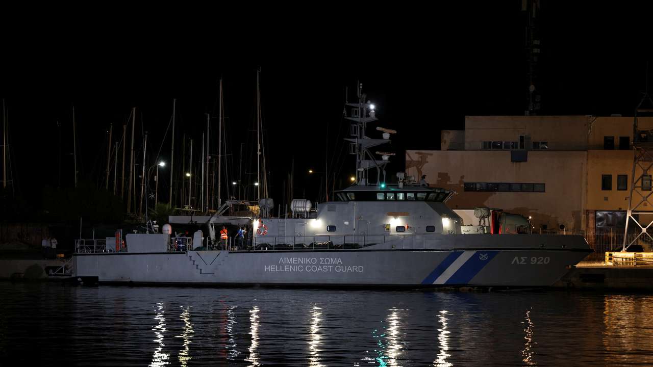 Body bags carrying migrants retrieved from sea arrive in Kalamata