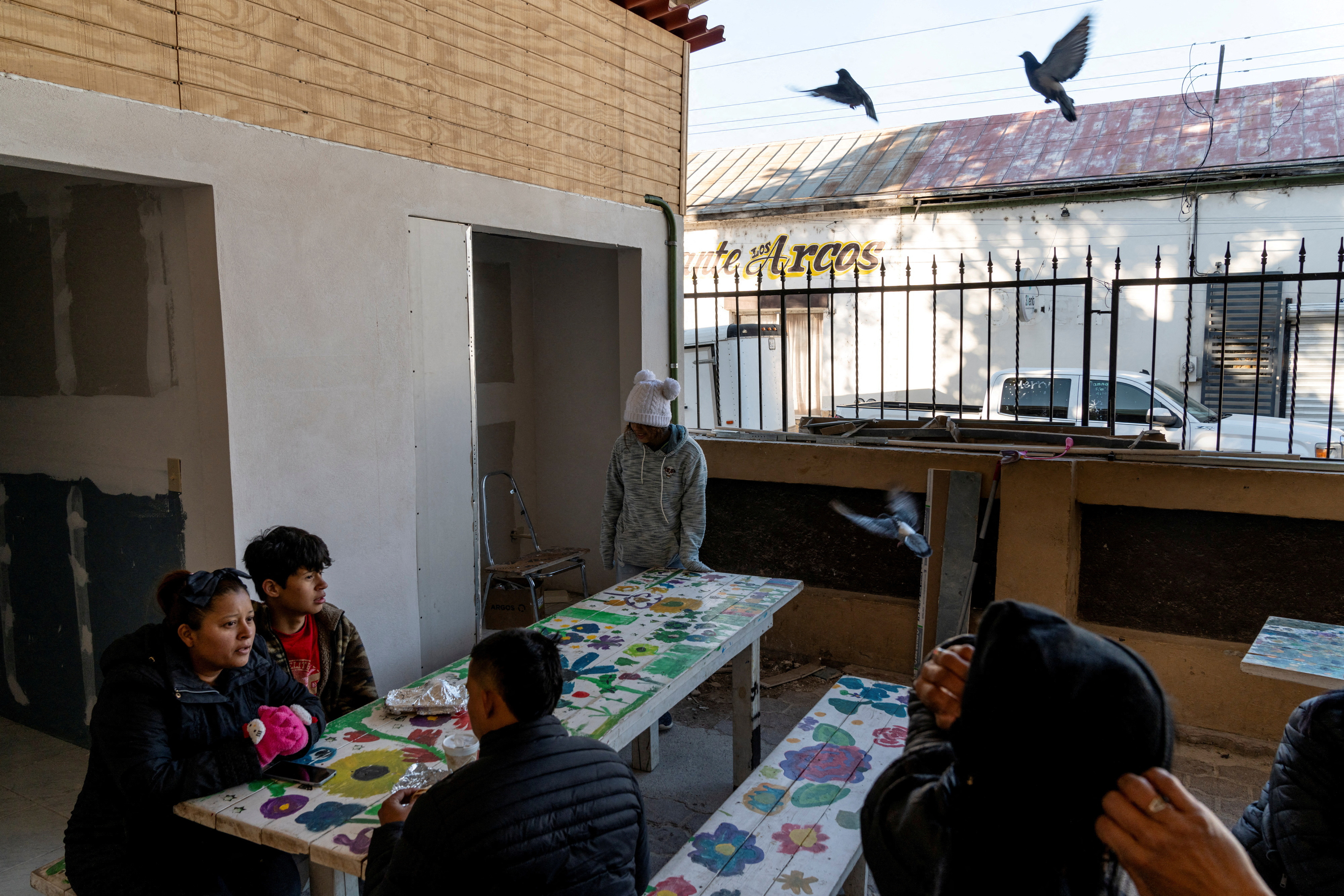FILE PHOTO: Asylum seekers attend a church service ahead of the inauguration of U.S. President-elect Donald Trump