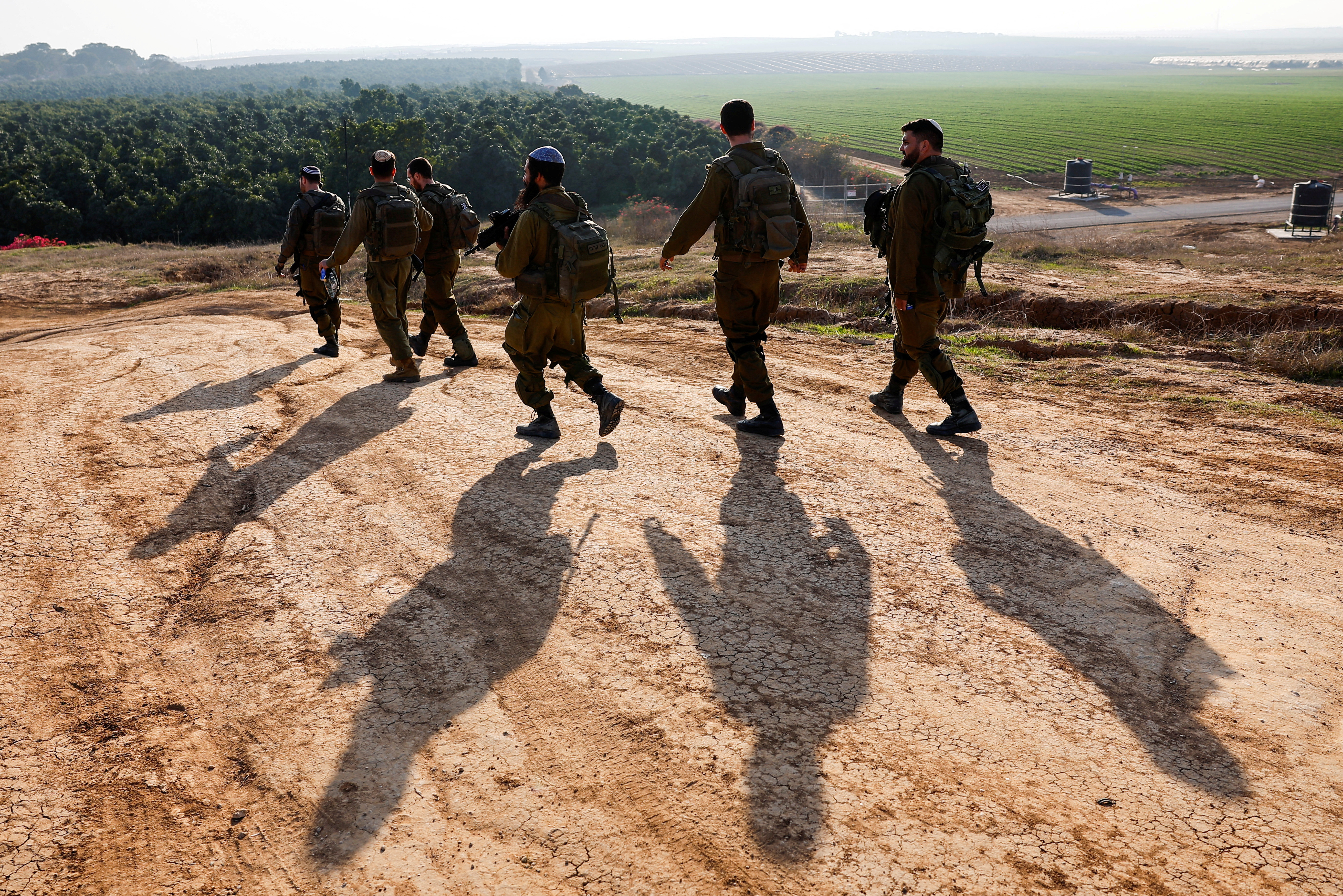 Israeli soldiers patrol near the Israel-Gaza border