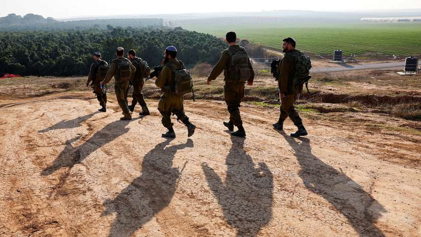 Israeli soldiers patrol near the Israel-Gaza border