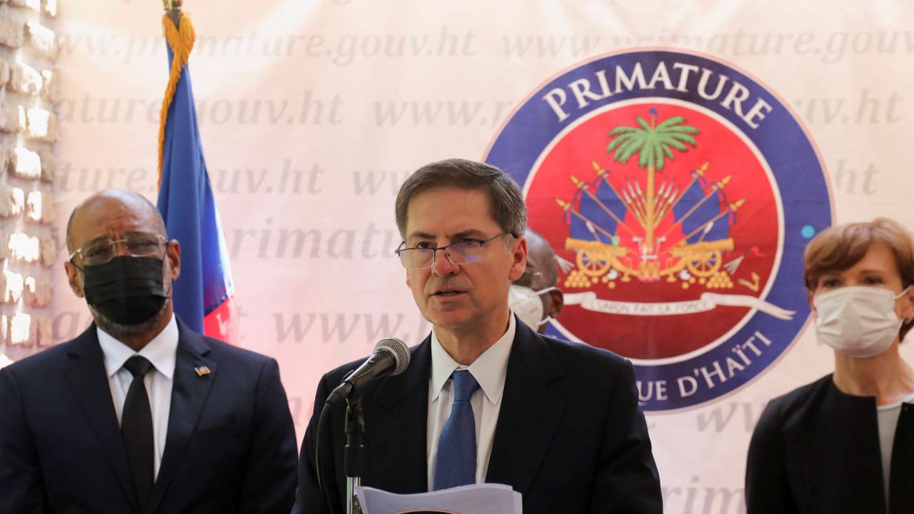 Haiti's Prime Minister Ariel Henry and World Bank Vice President for the Latin America and the Caribbean Region Carlos Felipe Jaramillo address the audience, in Port-au-Prince