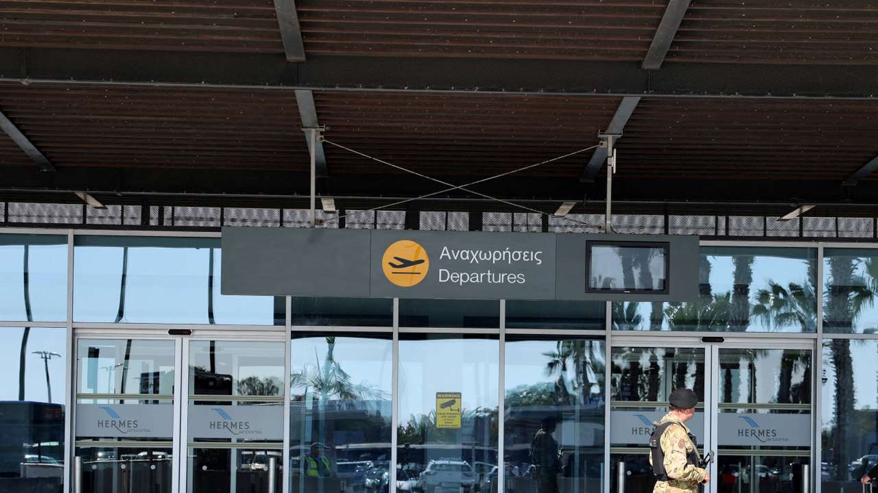 Police officer patrols at Paphos International Airport in Paphos