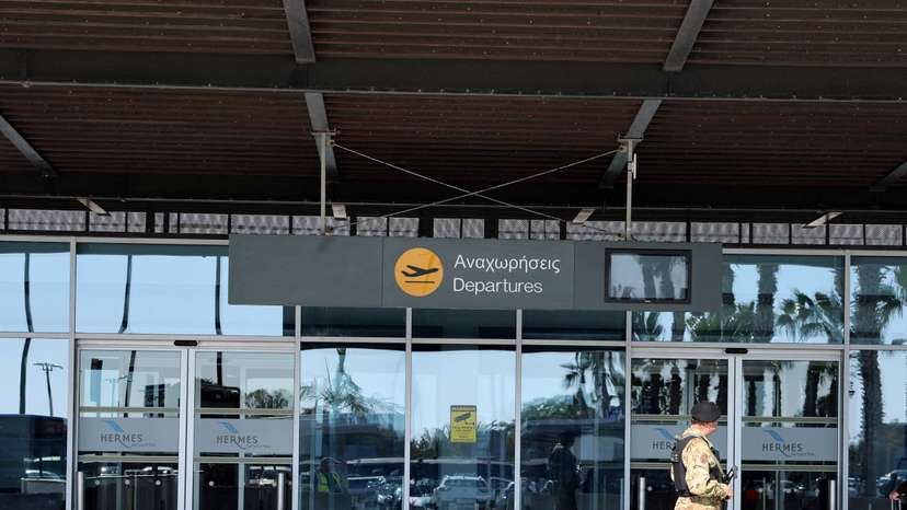 Police officer patrols at Paphos International Airport in Paphos