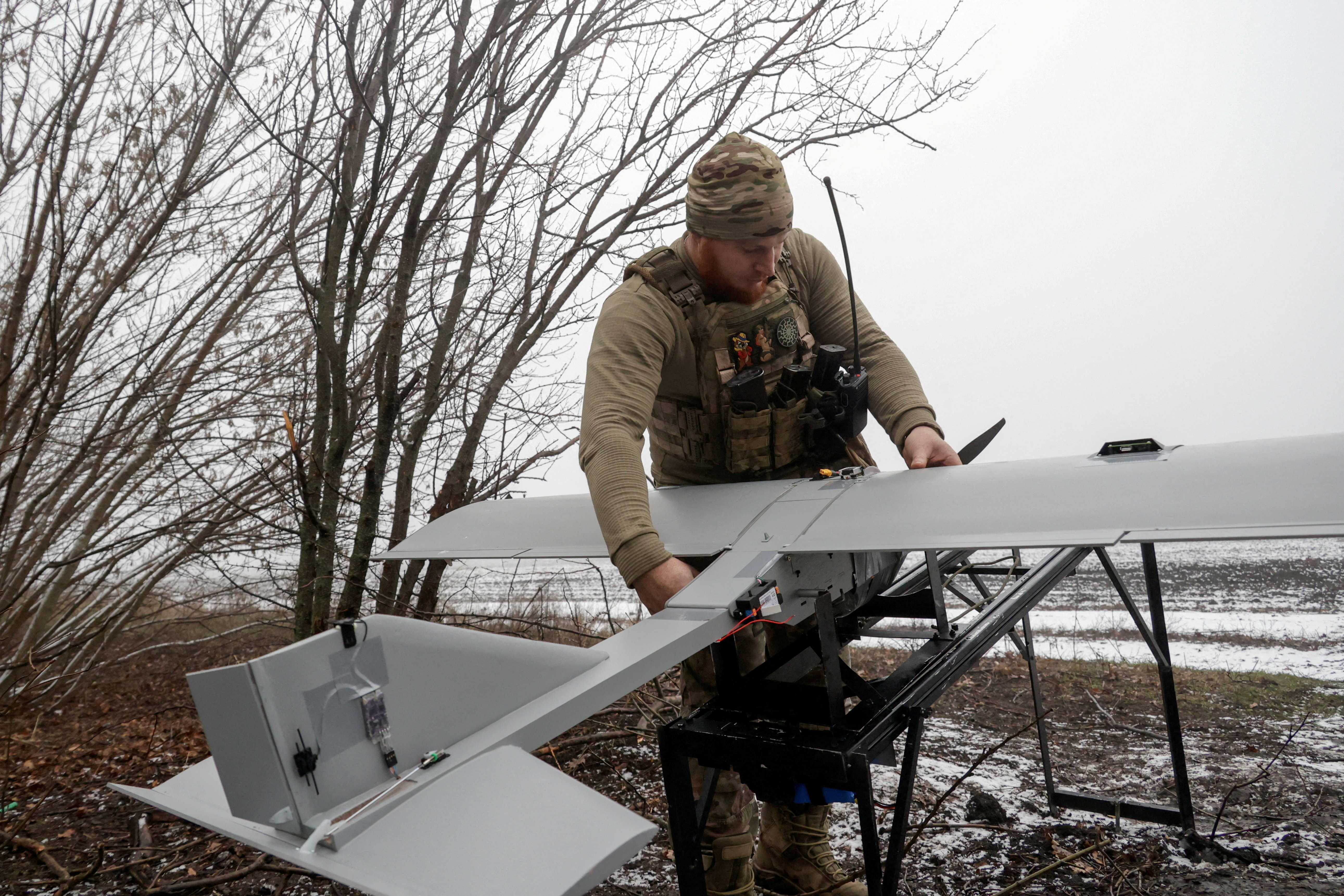 FILE PHOTO: Ukrainian servicemen operate a Darts strike drone at their position near a front line in Donetsk region