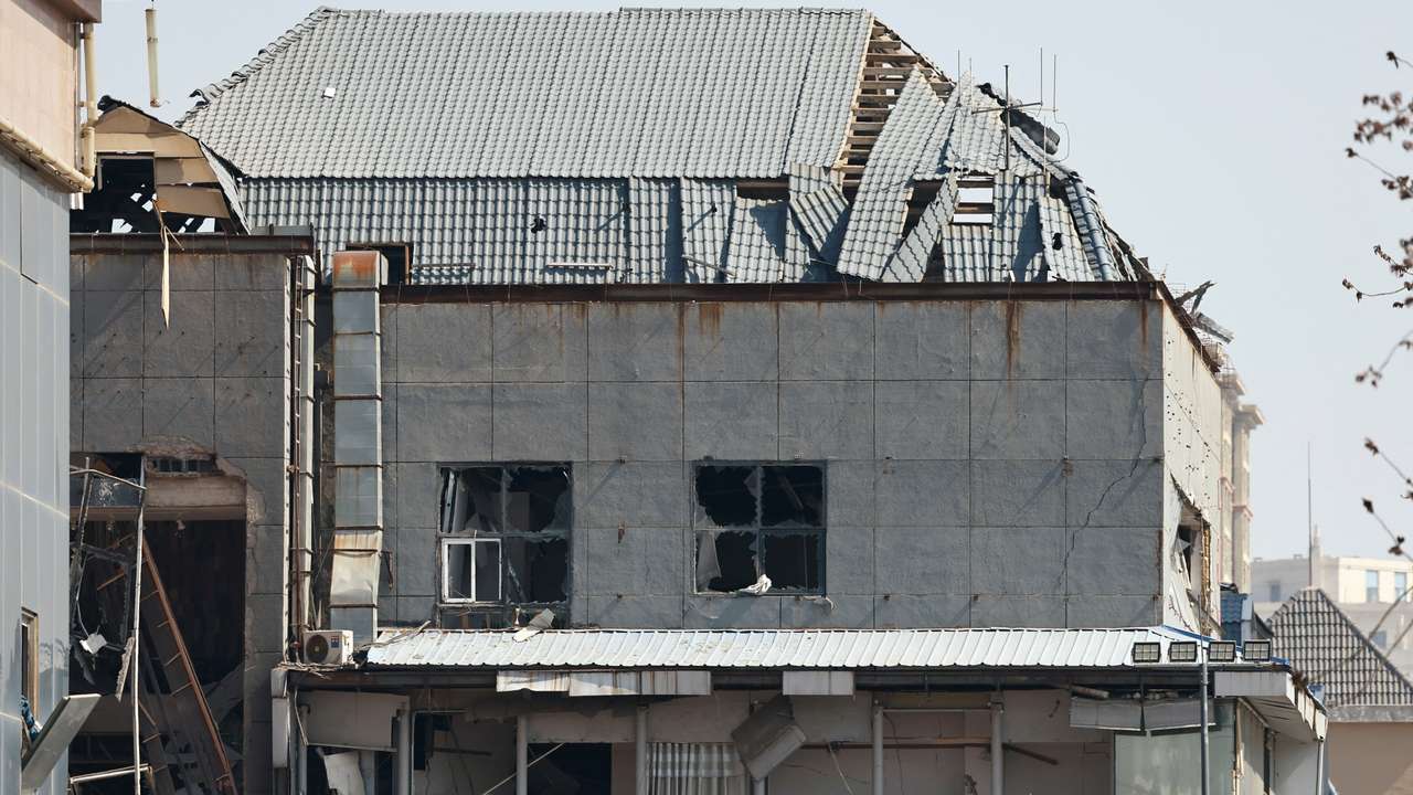 A view of a damaged building at the site of a restaurant blast in Sanhe