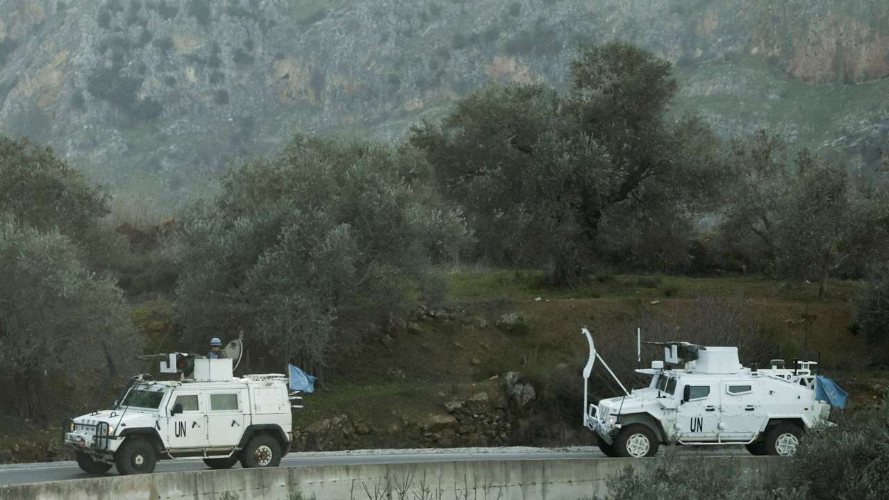FILE PHOTO: UN peacekeepers (UNIFIL) vehicles ride along a street in Marjaayoun