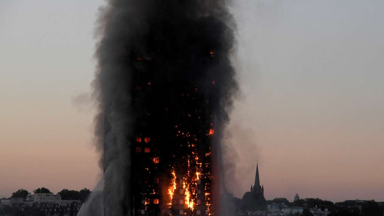 FILE PHOTO: Flames and smoke billow from the Grenfell Tower apartment block in West London,