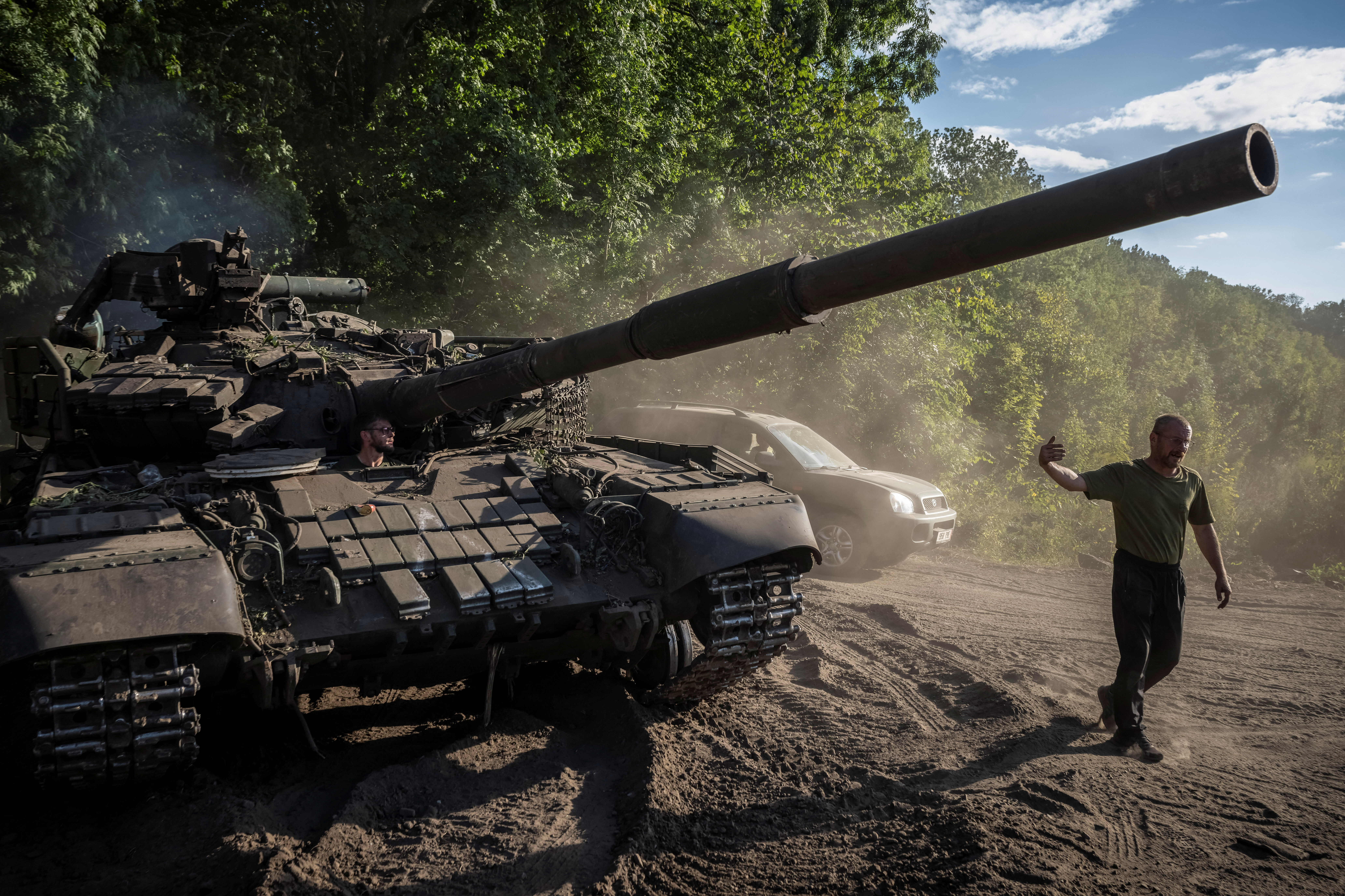 Ukrainian serviceman operates a tank near the Russian border in Sumy region