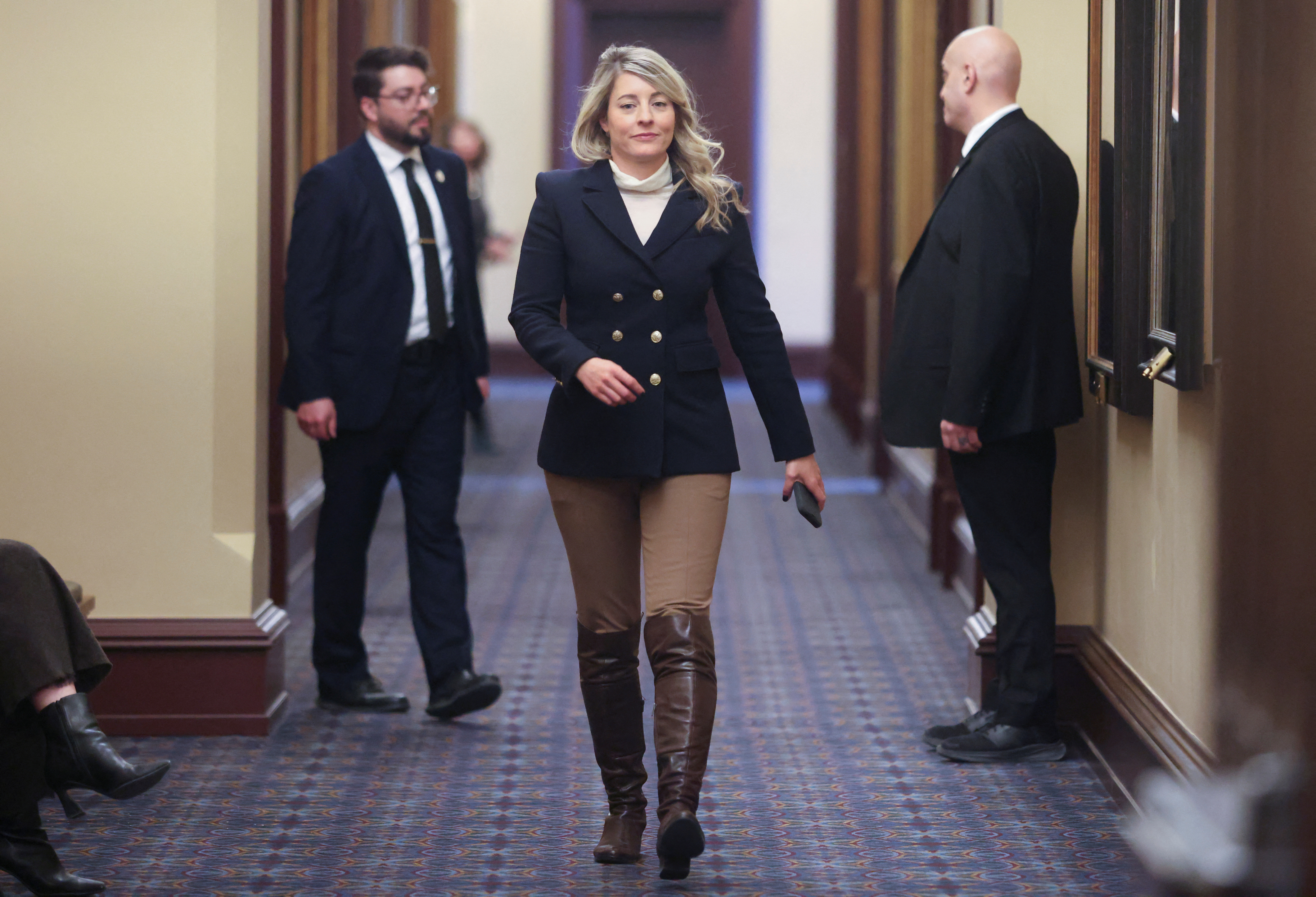 Canada's Minister of Foreign Affairs Melanie Joly returns to a caucus meeting after a break on Parliament Hill in Ottawa
