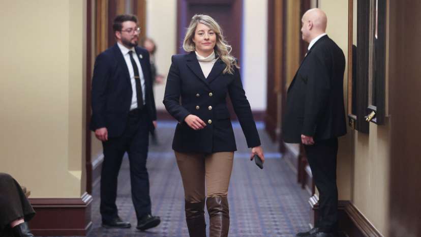 Canada's Minister of Foreign Affairs Melanie Joly returns to a caucus meeting after a break on Parliament Hill in Ottawa