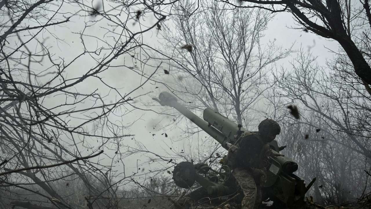 A serviceman fires a howitzer towards Russian troops at a position in a front line in Zaporizhzhia region