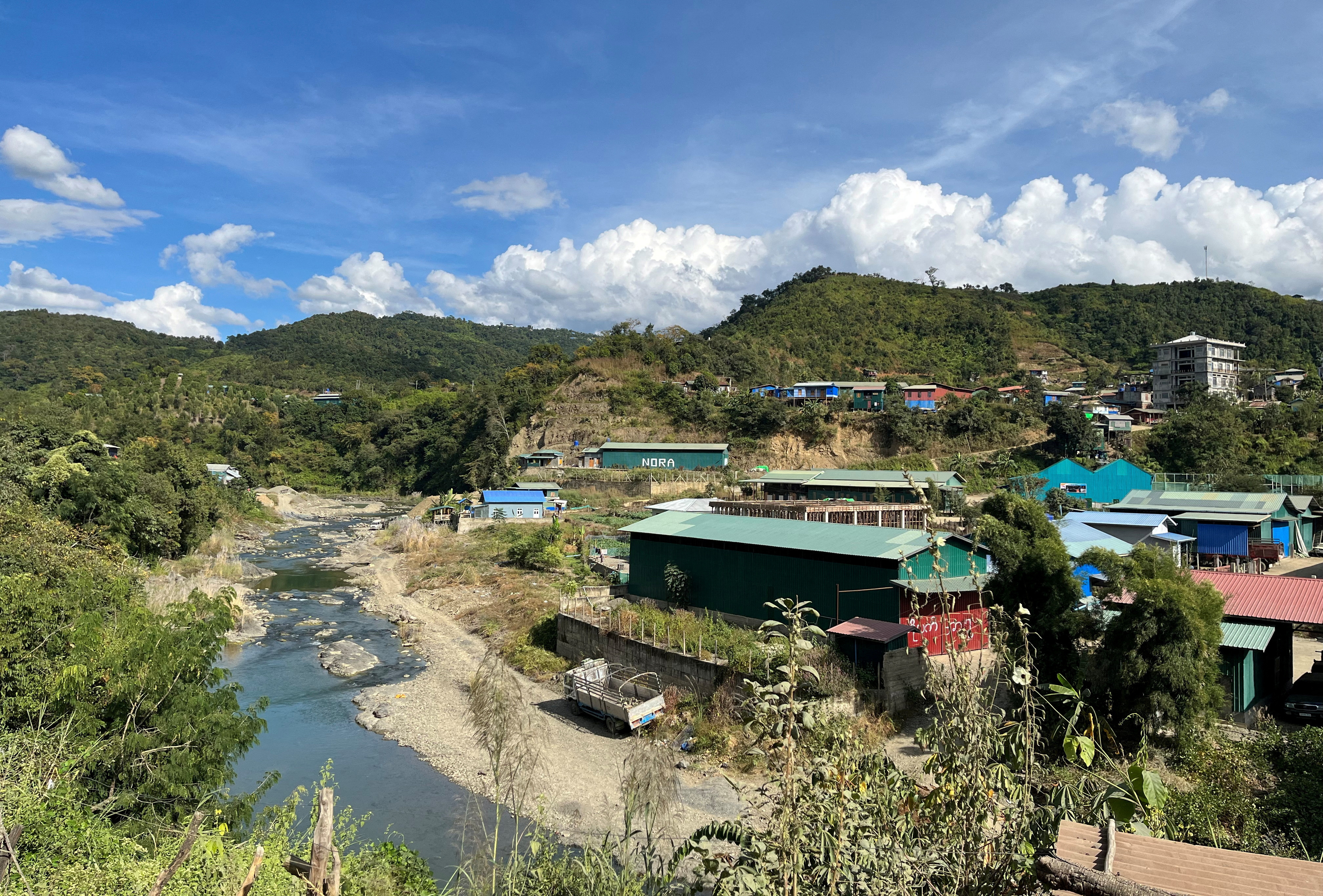 A view of Myanmar's Khawmawi village on the India-Myanmar border across the Tiau river as seen from Zokhawthar village