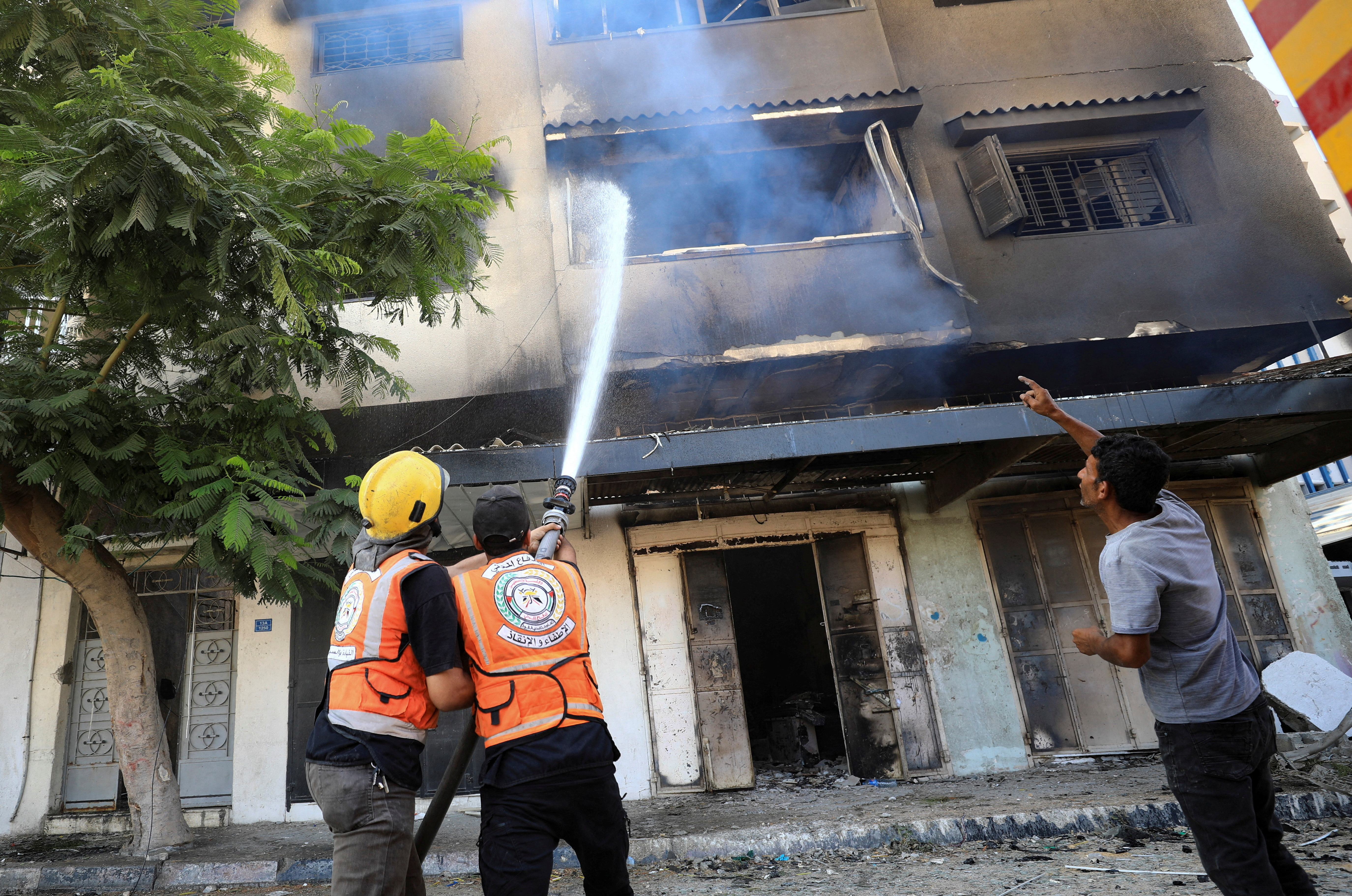 Palestinians inspect damages after Israeli forces withdrew from a part of Gaza City