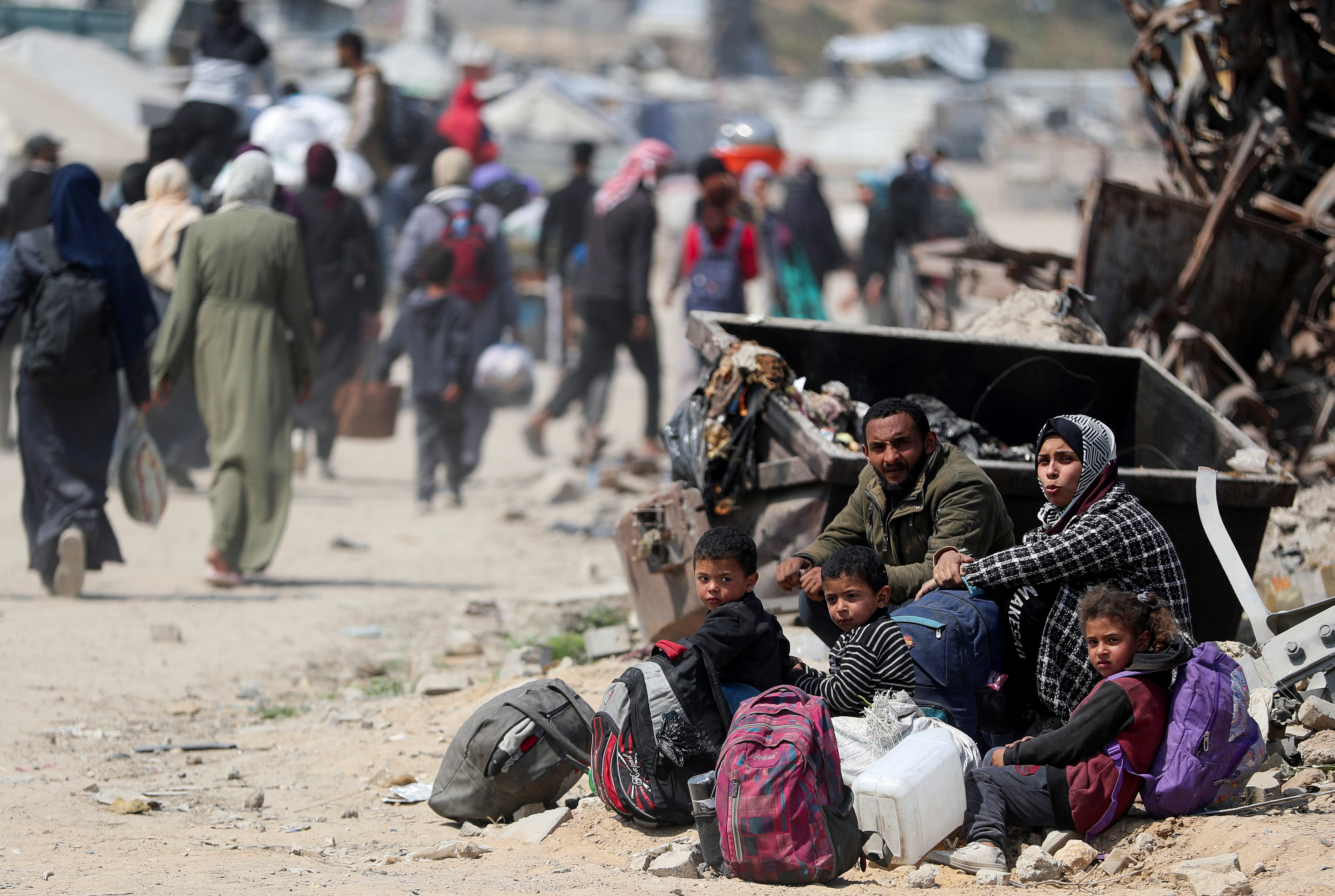 Palestinians make their way to flee their homes, in the northern Gaza Strip