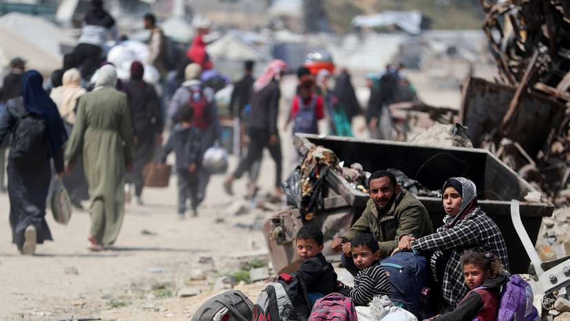 Palestinians make their way to flee their homes, in the northern Gaza Strip