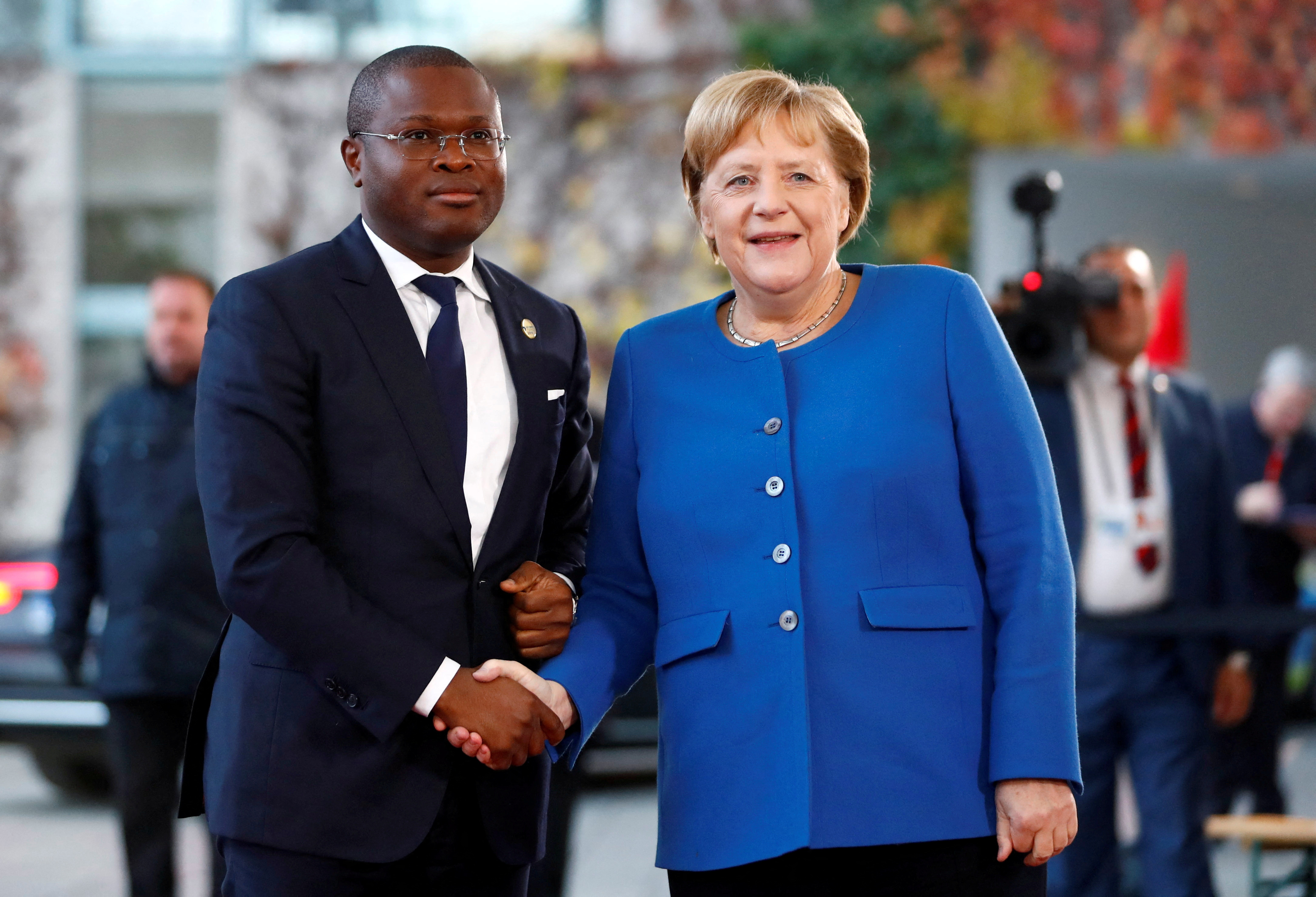 FILE PHOTO: German Chancellor Angela Merkel welcomes Benin's Finance Minister Romuald Wadagni at the Chancellery in Berlin