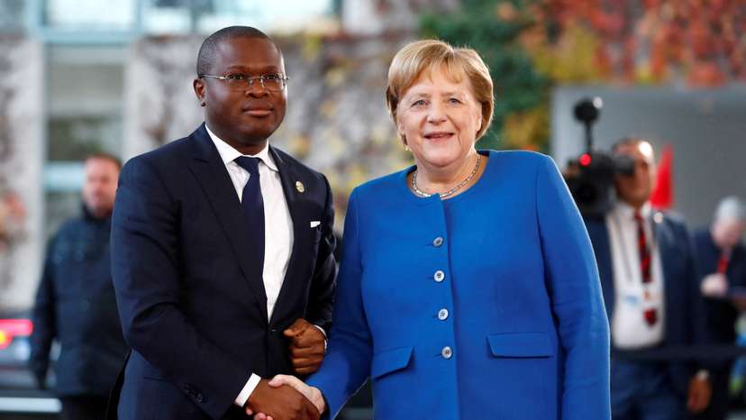 FILE PHOTO: German Chancellor Angela Merkel welcomes Benin's Finance Minister Romuald Wadagni at the Chancellery in Berlin