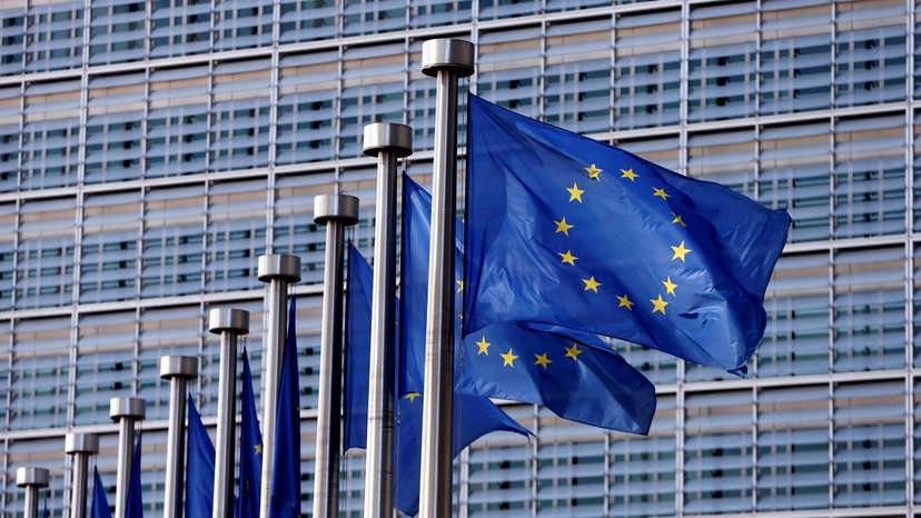 EU flags flutter outside the EU Commission headquarters in Brussels