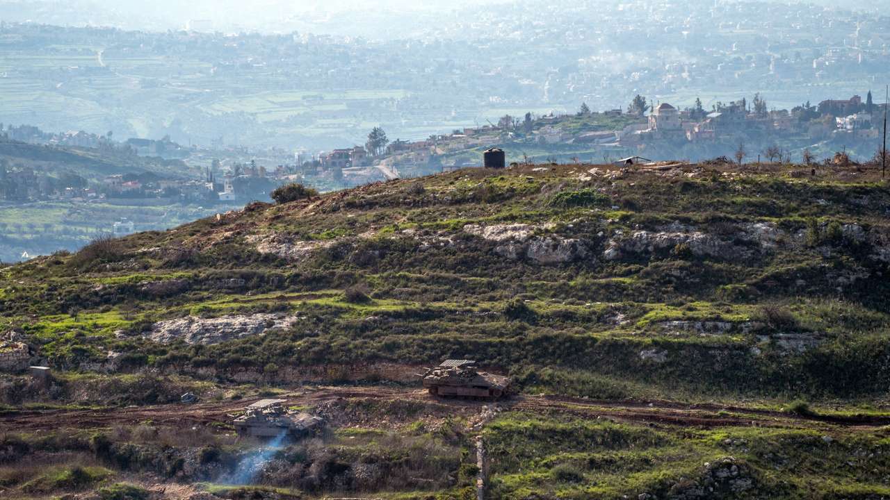 Israeli tanks drive on the Lebaness side of the Israel Lebanon border as seen from Israel, following an escalation between Hezbollah and Israel amid the U.S.-Israeli conflict with Iran