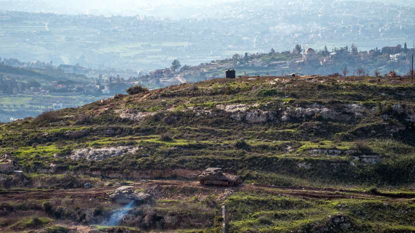 Israeli tanks drive on the Lebaness side of the Israel Lebanon border as seen from Israel, following an escalation between Hezbollah and Israel amid the U.S.-Israeli conflict with Iran