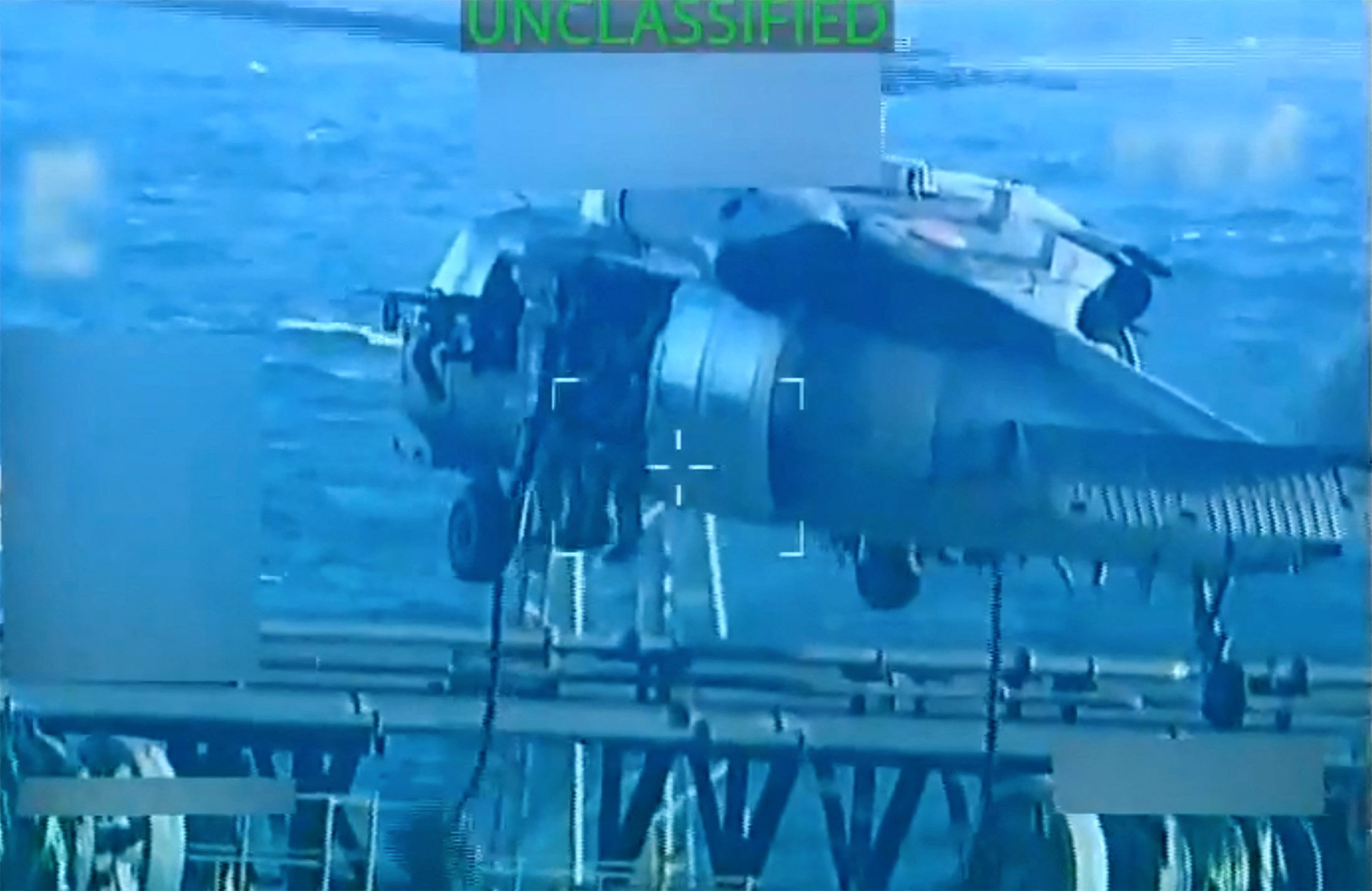 U.S. forces abseil onto an oil tanker during its seizure by the United States off the coast of Venezuela