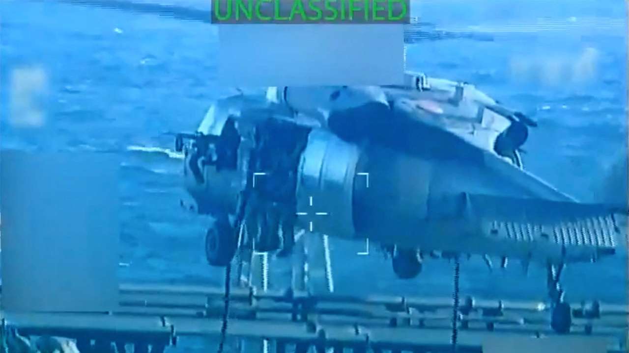 U.S. forces abseil onto an oil tanker during its seizure by the United States off the coast of Venezuela