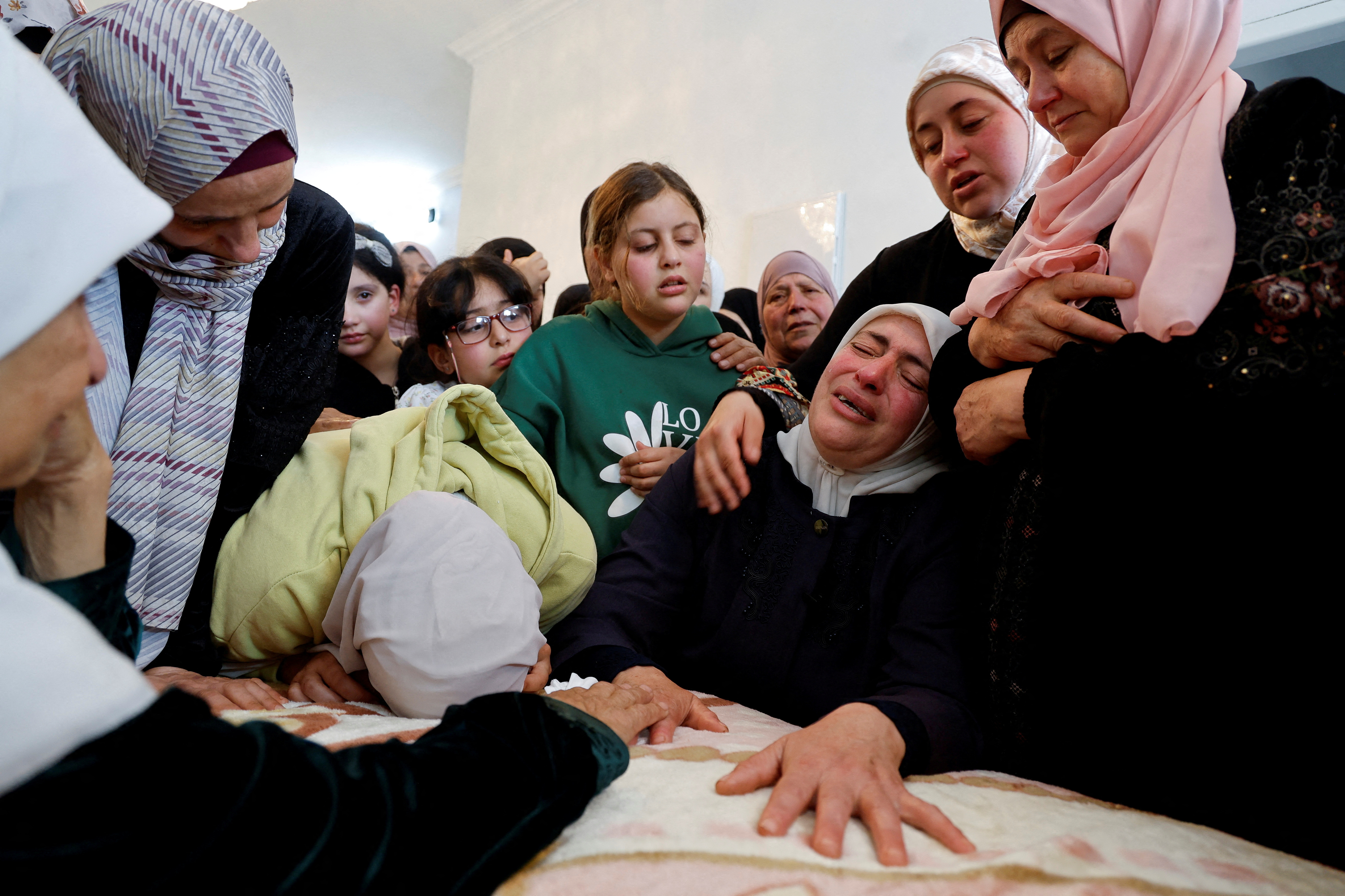 FILE PHOTO: Mourners attend the funeral of Palestinian Yazan Ishtayeh who was killed in an Israeli raid, near Nablus