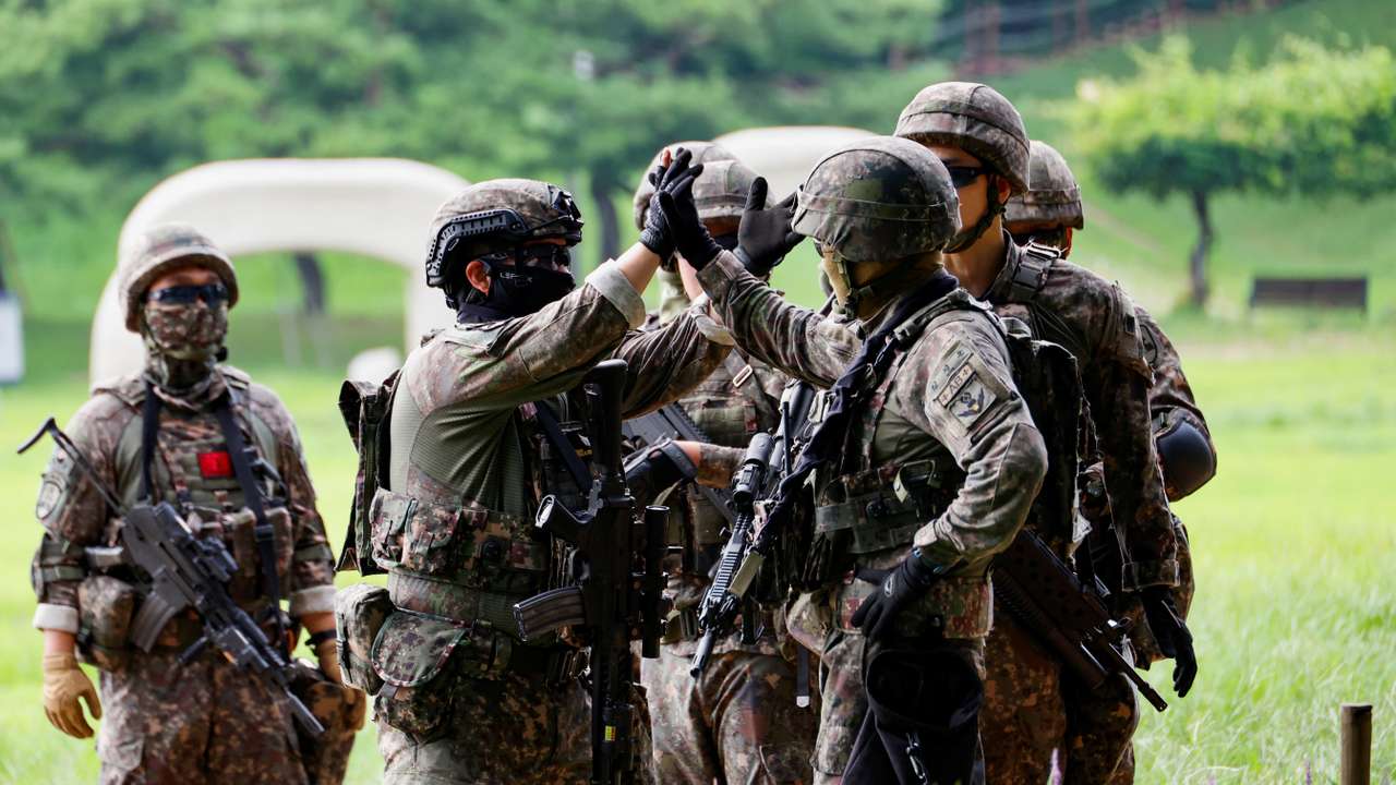 Soldiers take part in an anti-terror attack drill, in Seoul