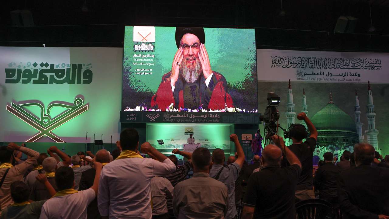 Lebanon's Hezbollah leader Sayyed Hassan Nasrallah addresses his supporters via a screen during a rally marking Prophet Mohammed's birthday, in Beirut suburbs