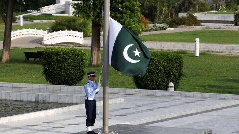 A member of the Pakistan Air Force (PAF) rehearses flag masting at the mausoleum of Muhammad Ali Jinnah before the Defence Day ceremonies, or Pakistan's Memorial Day, in Karachi