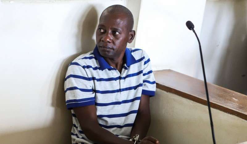 Paul Mackenzie, a Kenyan cult leader accused of ordering his followers, who were members of the Good News International Church, to starve themselves to death in Shakahola forest, sits in the dock at the Malindi Law Courts