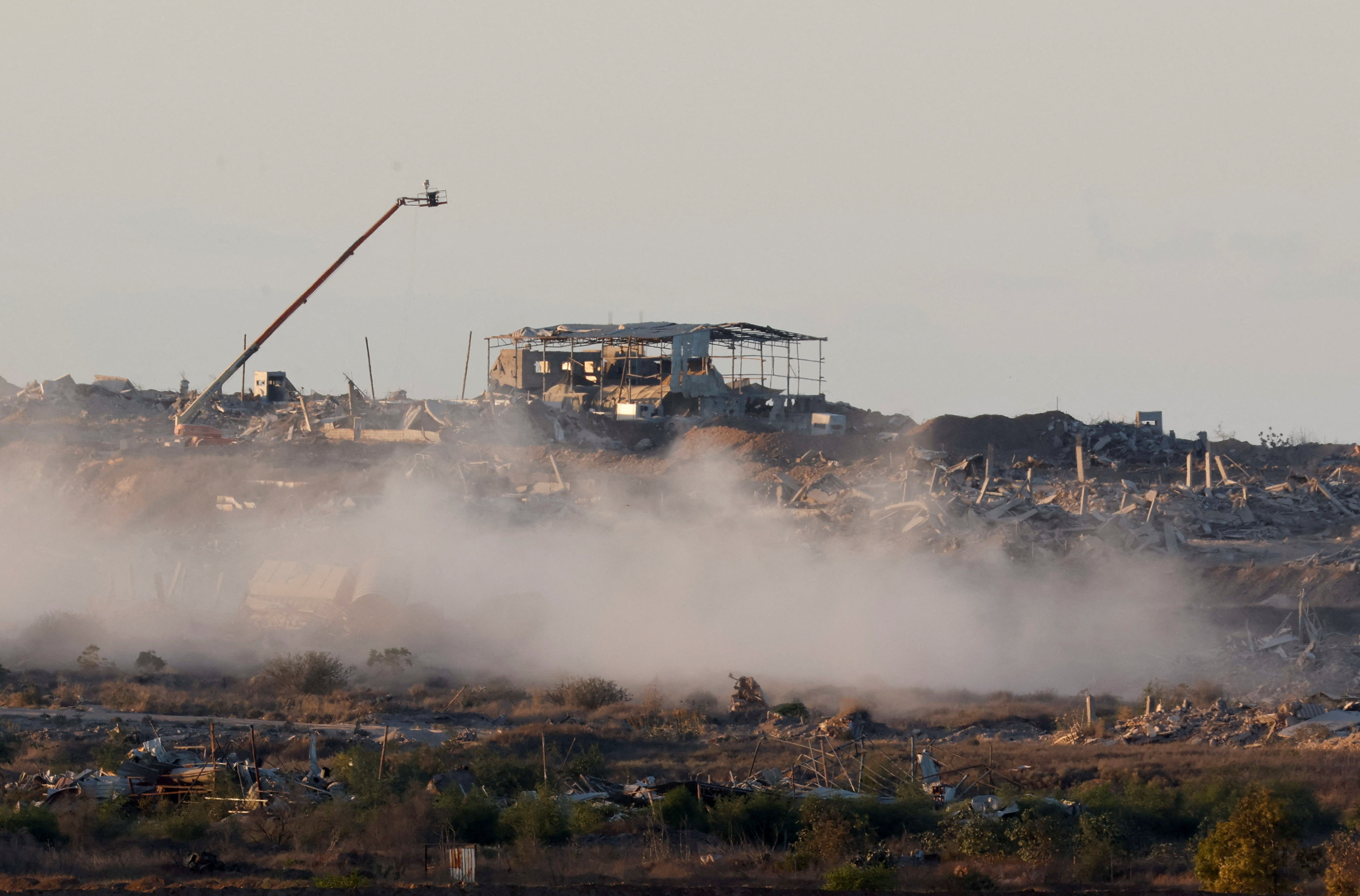 Destroyed buildings following explosions in Gaza, as seen from southern Israel