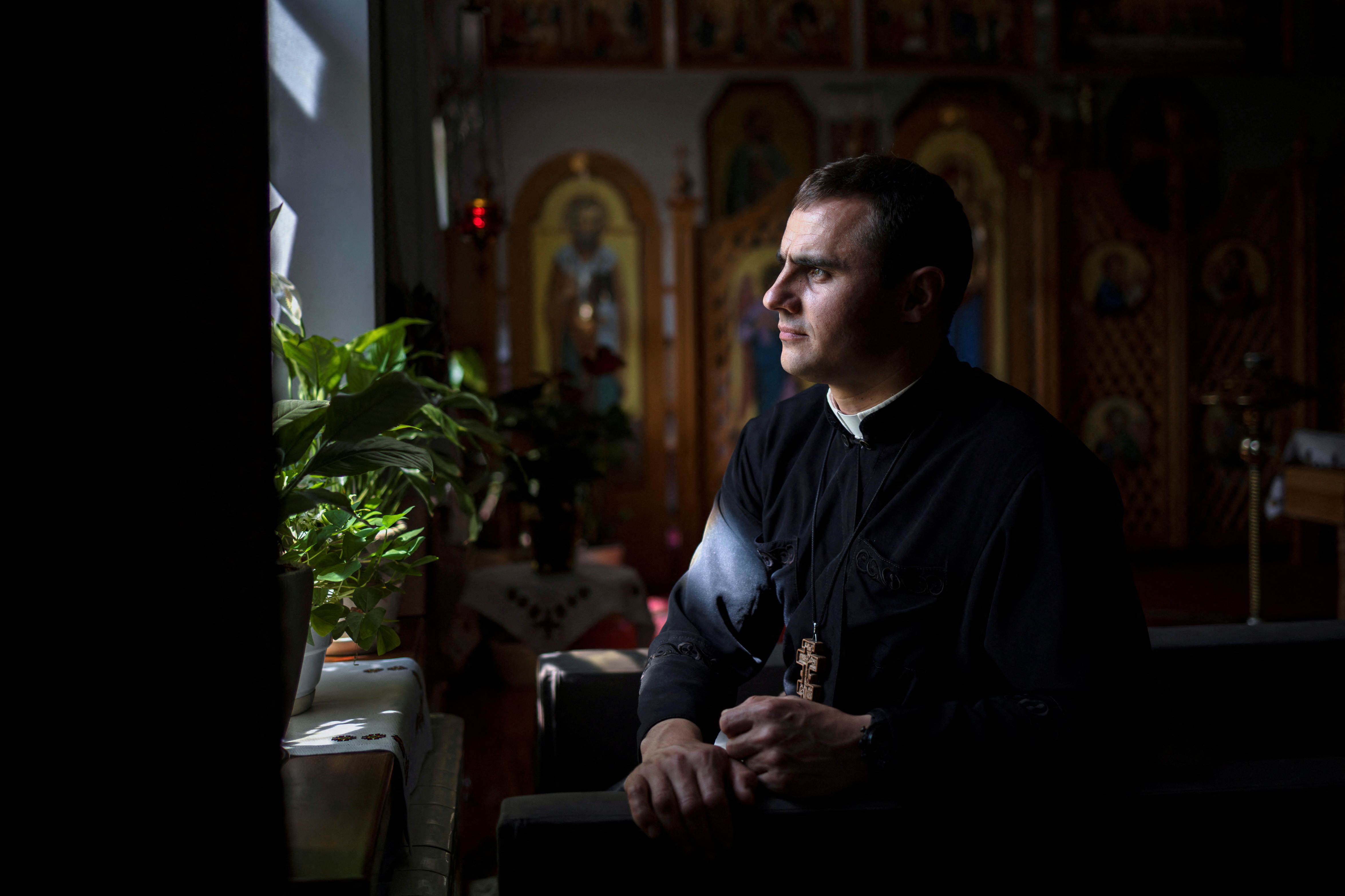 The Wider Image: Ukraine's Catholics tend to faithful driven out by Russian occupation