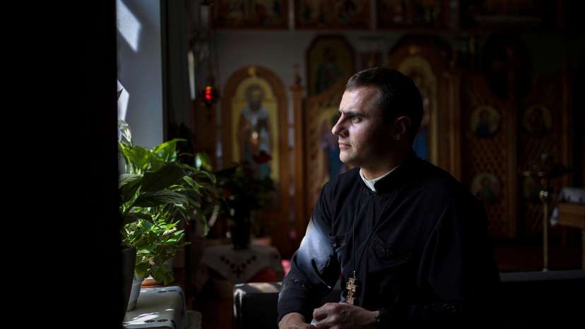 The Wider Image: Ukraine's Catholics tend to faithful driven out by Russian occupation