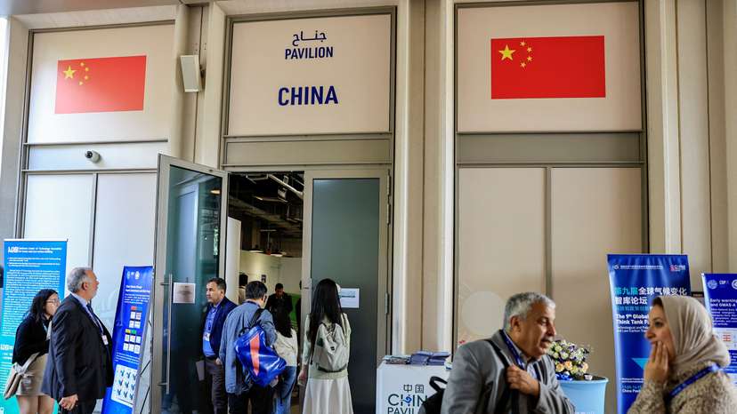 People stand outside the China Pavilion at the United Nations Climate Change Conference COP28 in Dubai