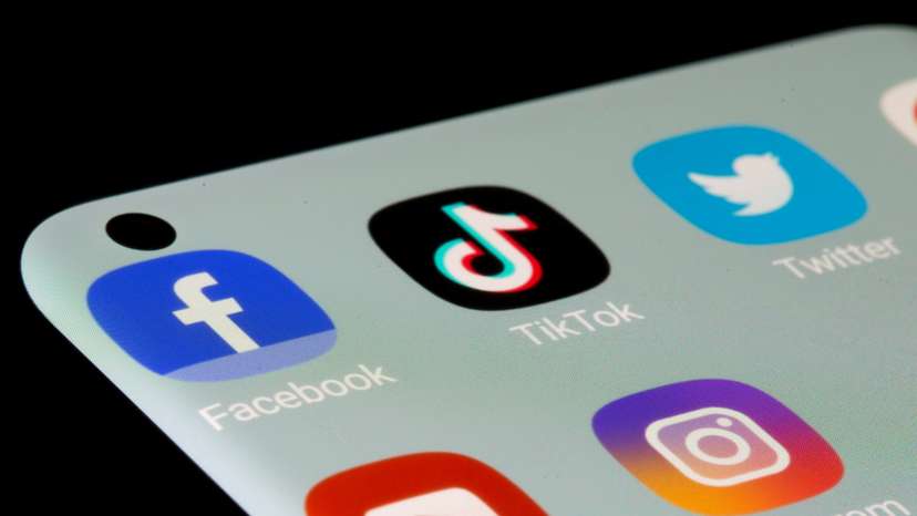 Facebook, TikTok, Twitter, YouTube and Instagram apps are seen on a smartphone in this illustration