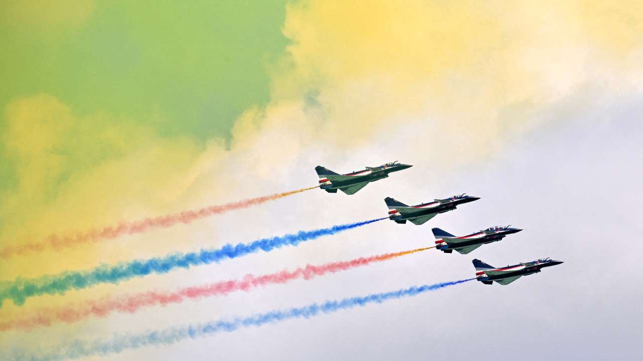FILE PHOTO: The People's Liberation Army Air Force Bayi Aerobatic Team perform during an aerial flying display at the Singapore Airshow at Changi Exhibition Centre in Singapore