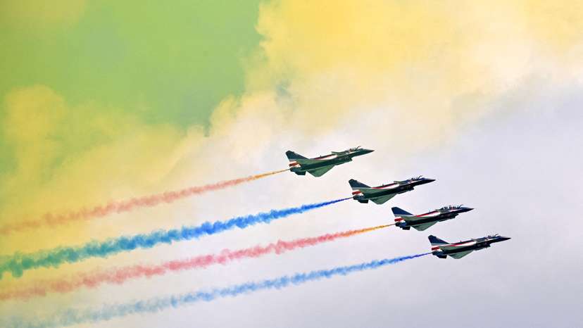 FILE PHOTO: The People's Liberation Army Air Force Bayi Aerobatic Team perform during an aerial flying display at the Singapore Airshow at Changi Exhibition Centre in Singapore