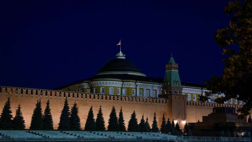 The Russian flag flies on the dome of the Kremlin Senate building in Moscow