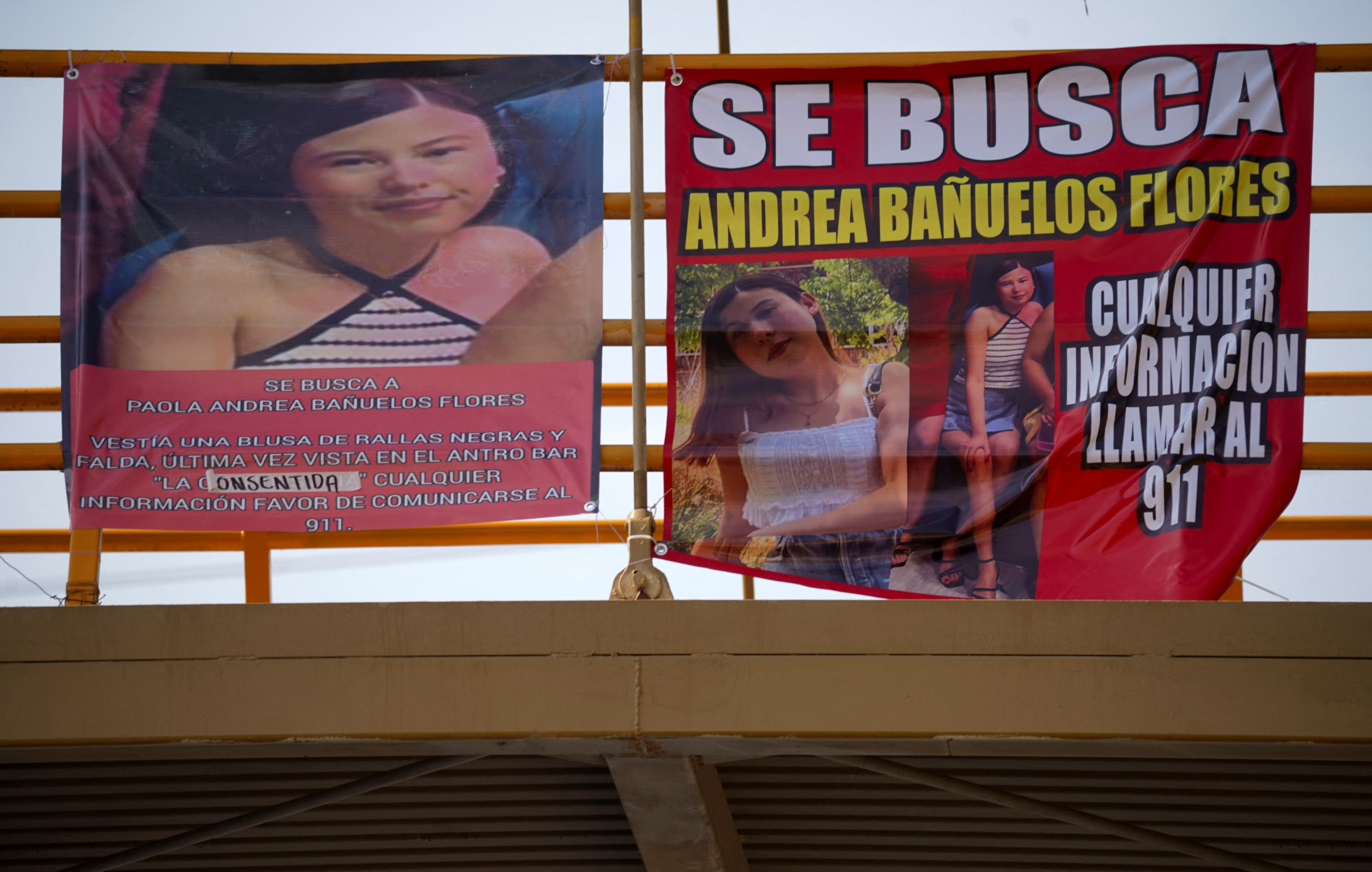 A view shows banners on a bridge with images that read "Wanted" of Paola Banuelos, in Mexicali