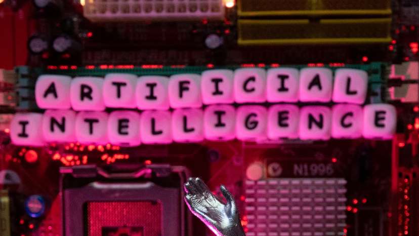 Illustration shows AI (Artificial Intelligence) letters and robot hand
