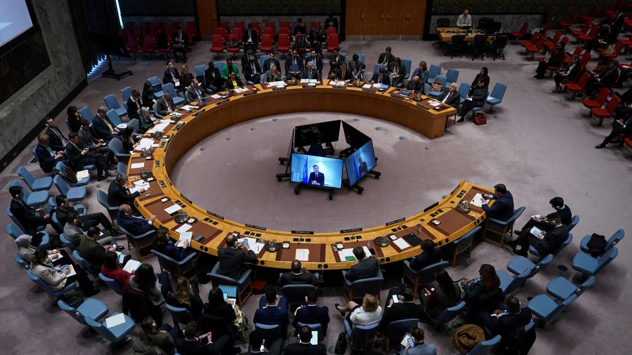 FILE PHOTO: People attend a Security Council meeting at the United Nations headquarters in New York City