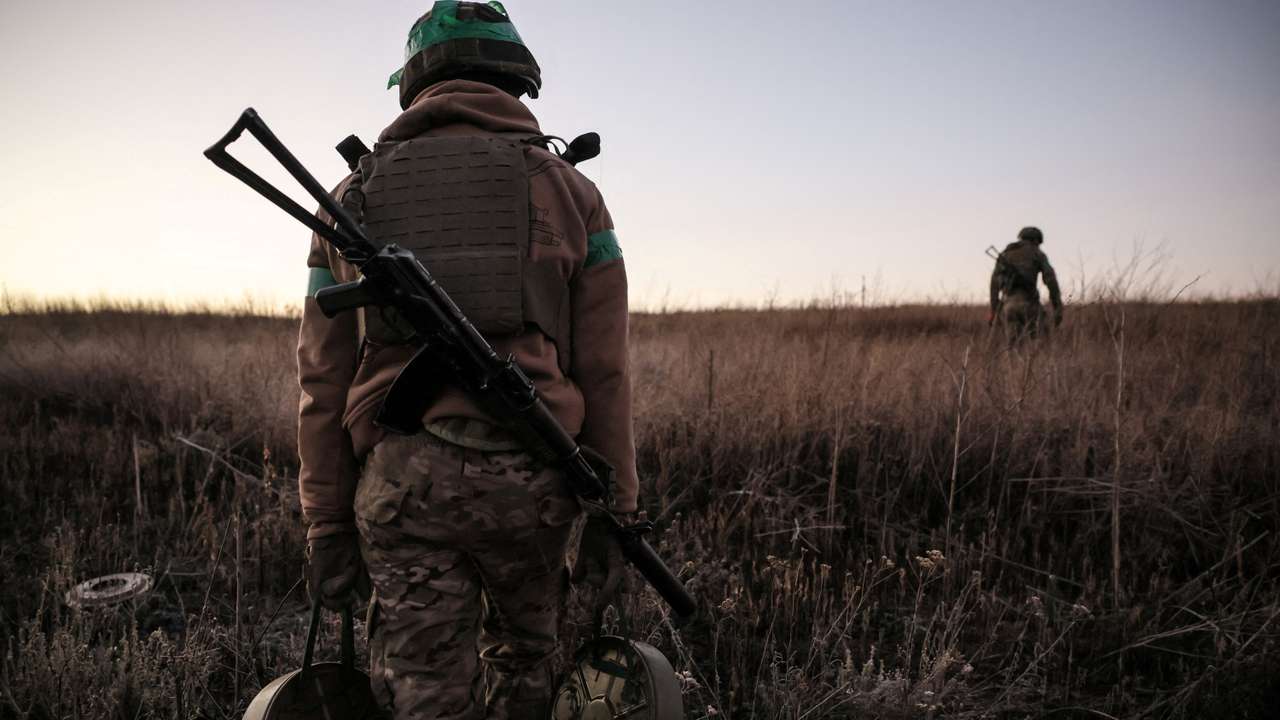Sappers prepare to install anti-tank landmines on the outskirts of the town of Chasiv Yar