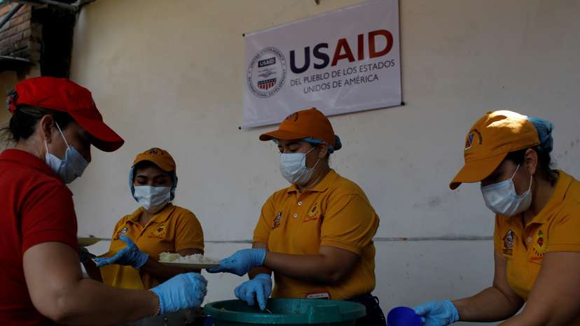 Volunteers serve lunch at a community kitchen set-up by USAID and World Food Programme in Cucuta