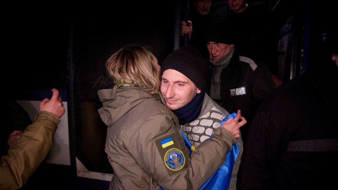 Ukrainian POWs leave a bus after a swap at an unknown location in Ukraine