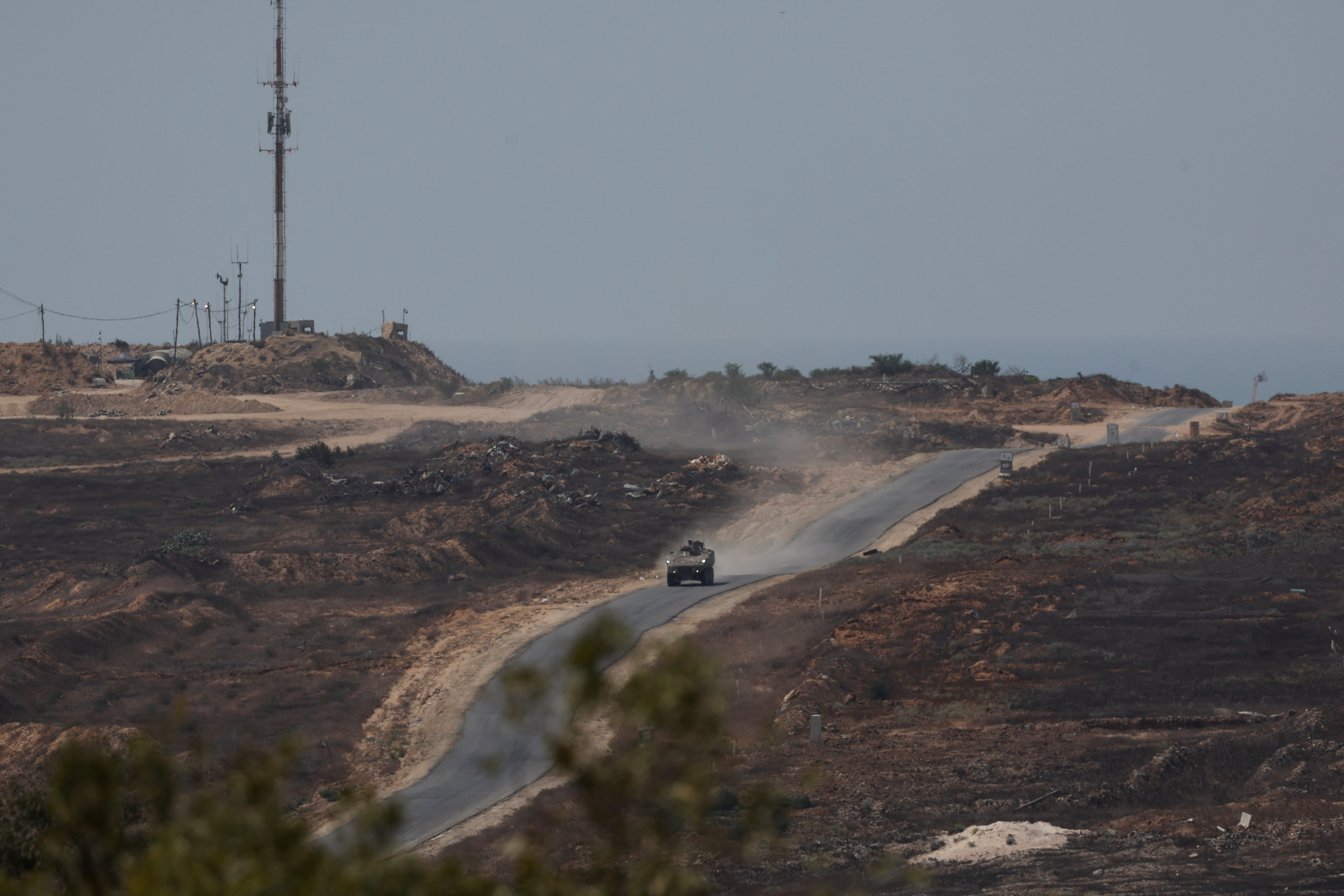 Israeli military vehicle manoeuvres inside the Gaza strip, as seen from Israel