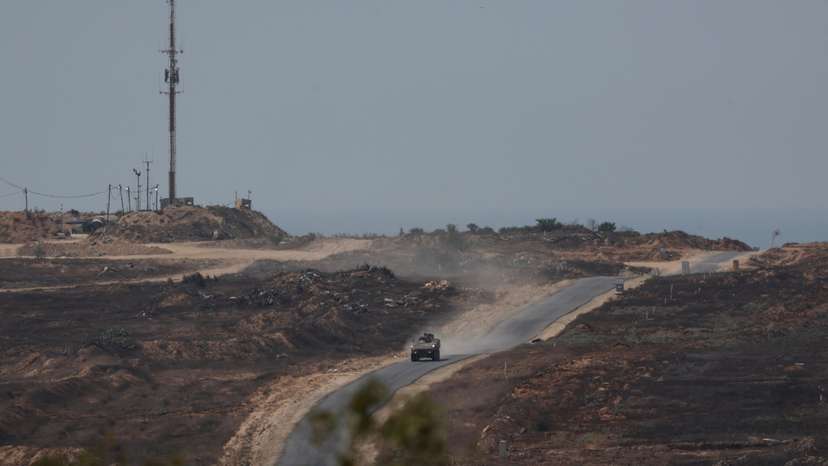 Israeli military vehicle manoeuvres inside the Gaza strip, as seen from Israel