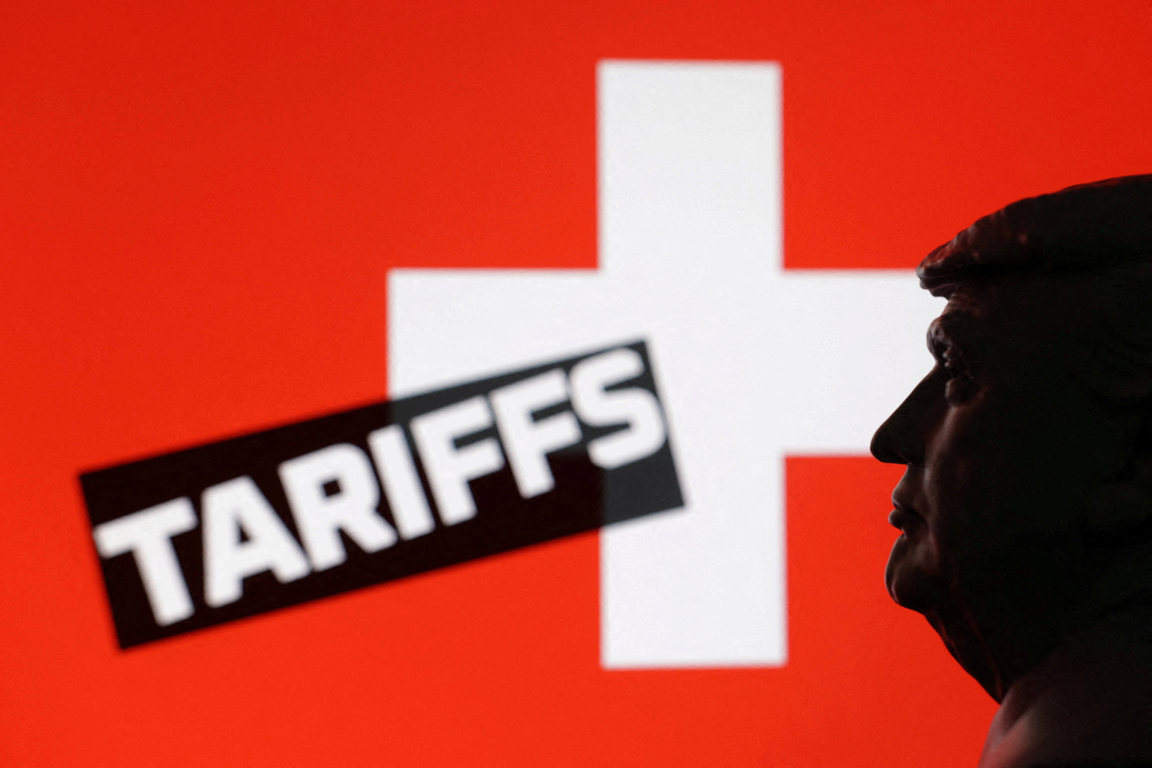 FILE PHOTO: Illustration shows 3D-printed miniature model of U.S. President Donald Trump, Switzerland flag and the word "Tariffs\