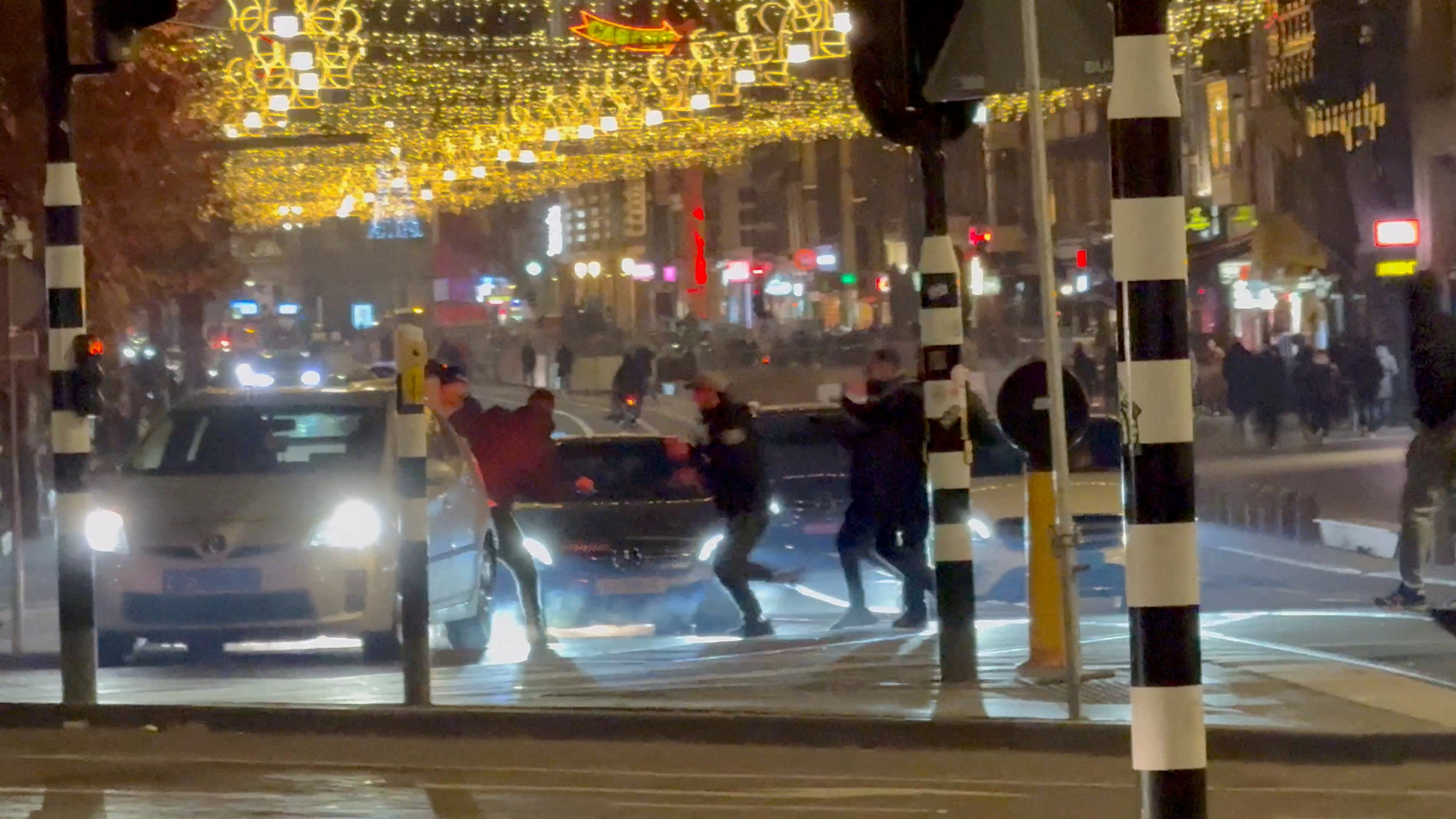 FILE PHOTO: Youth clash with Israeli football fans outside Amsterdam Central station