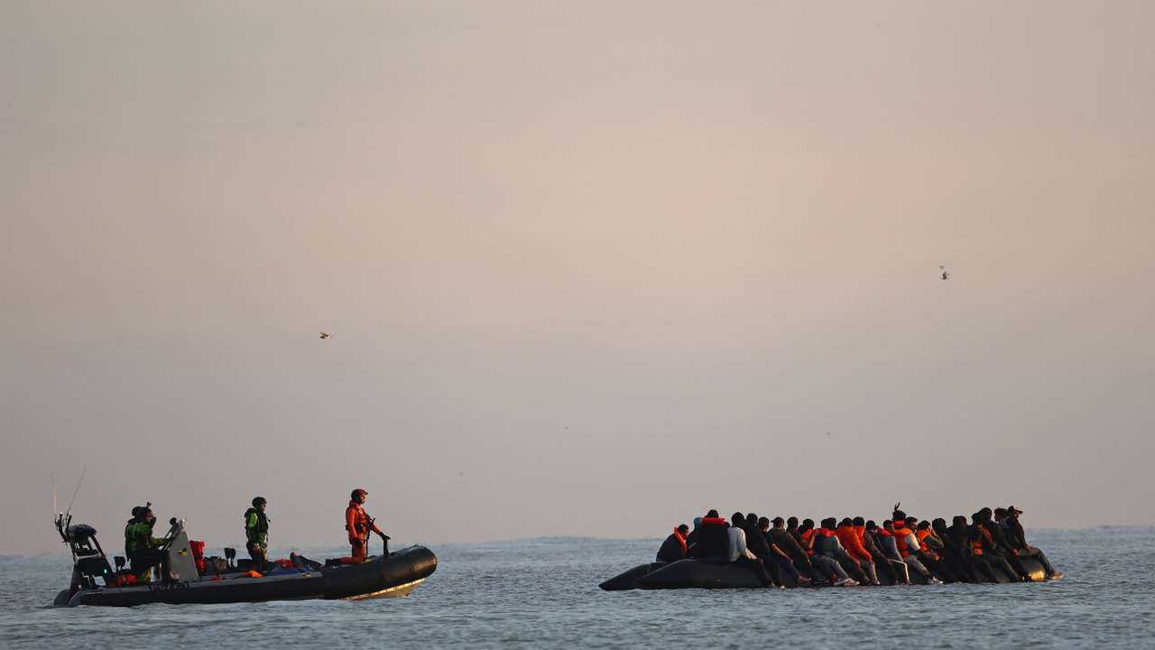 FILE PHOTO: Migrants leave French coast in dinghies as UK, France tighten asylum rules